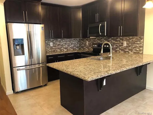 a bedroom with a bed and a ceiling fan