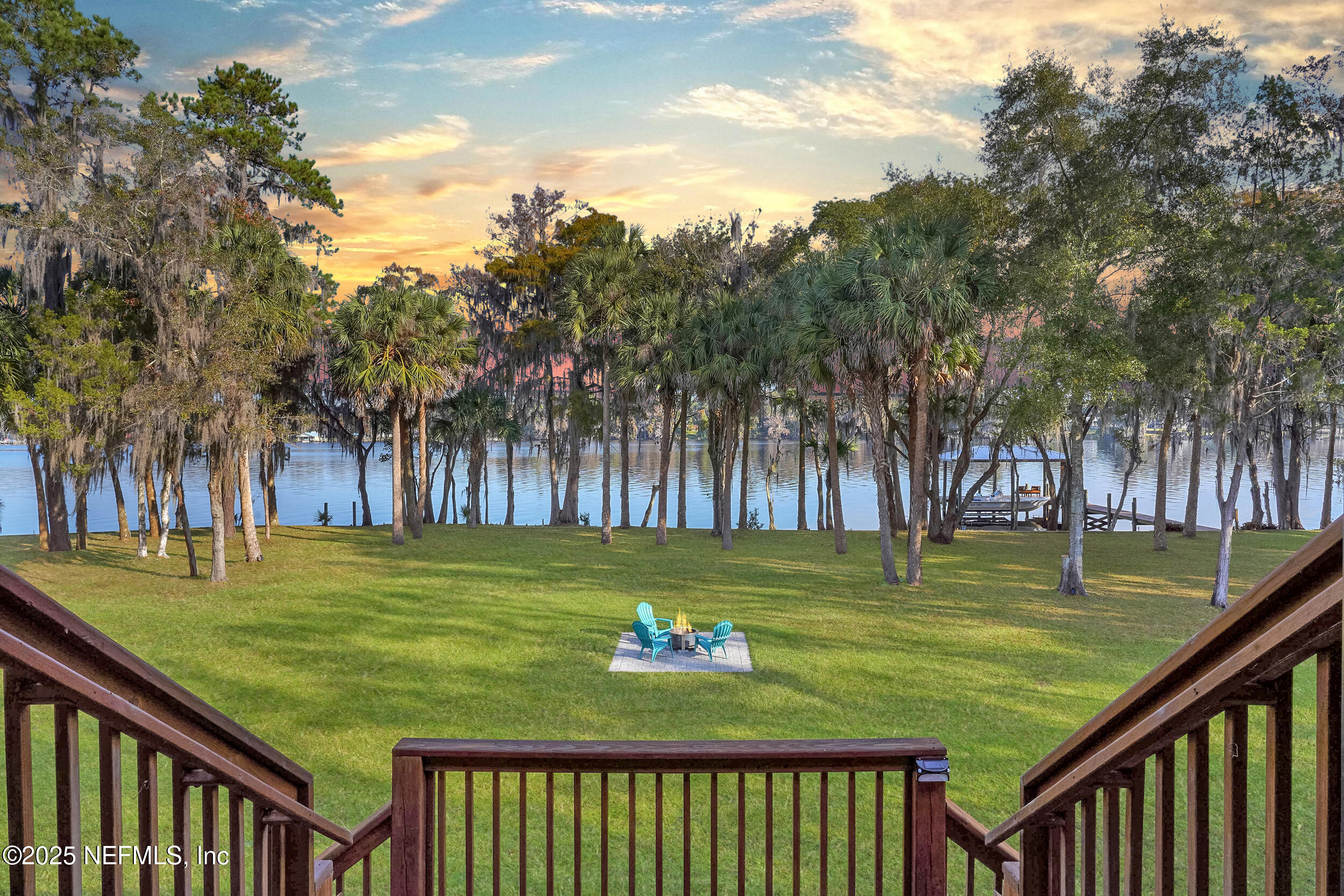 122 Drayton Island Road Georgetown, FL 32139 - Photo 14 of 58 a view of a wooden deck with trees in the background