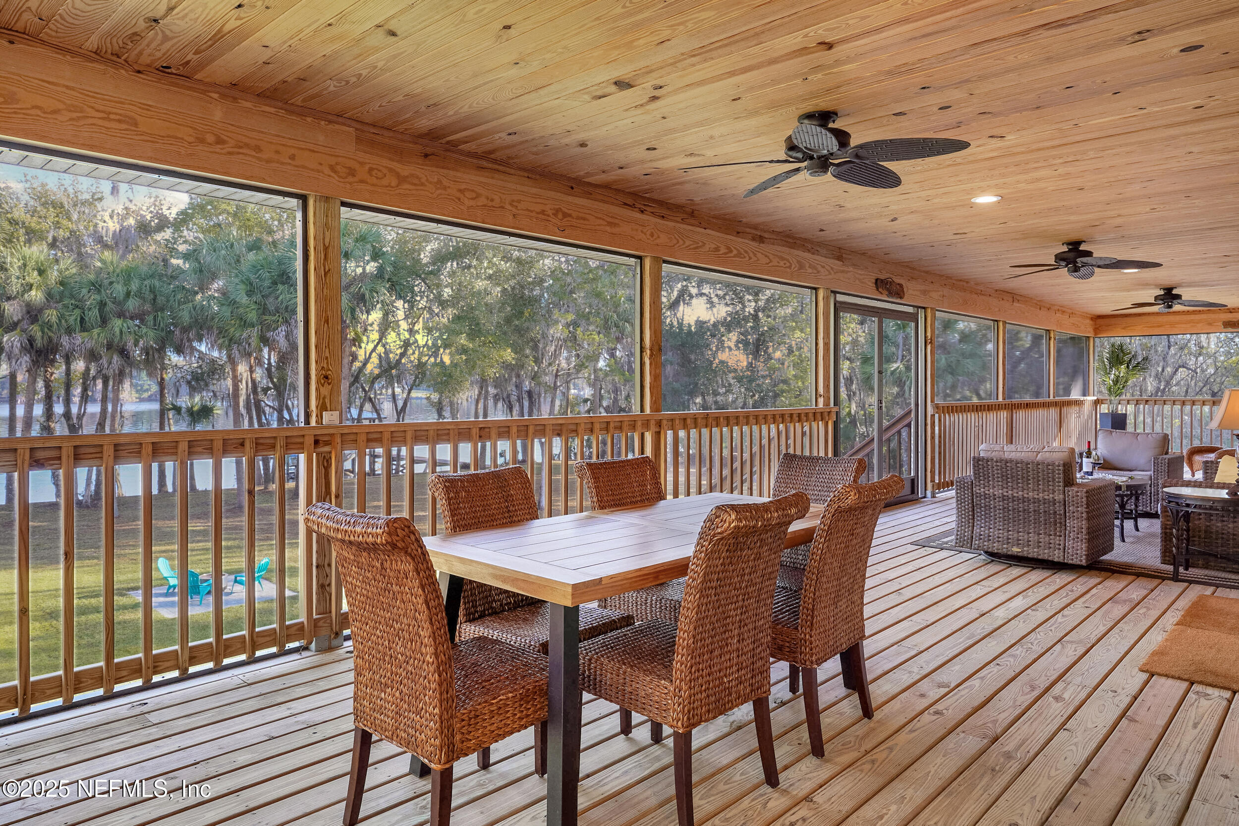 122 Drayton Island Road Georgetown, FL 32139 - Photo 21 of 59 a view of a dining room with furniture window and wooden floor