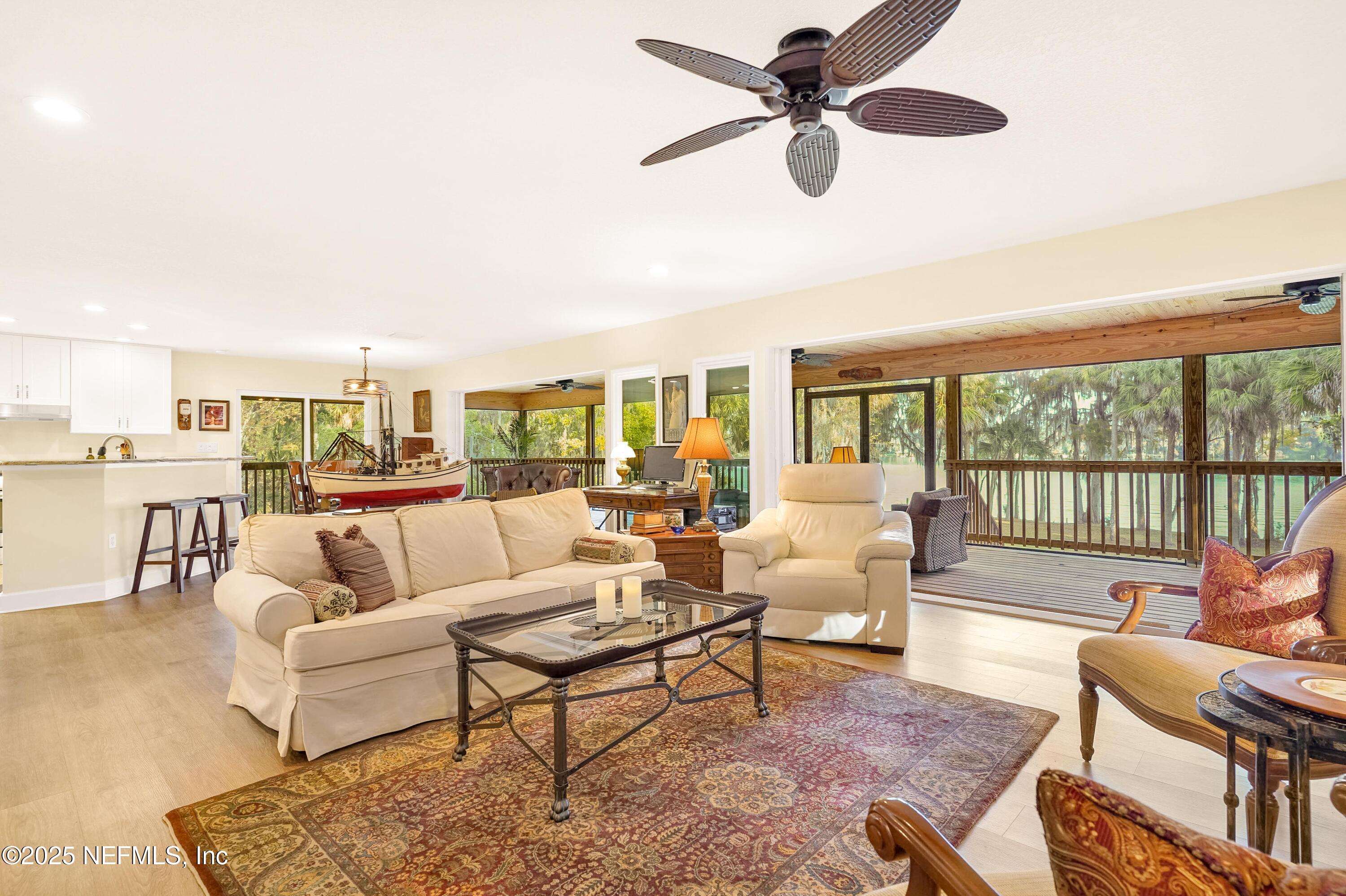 122 Drayton Island Road Georgetown, FL 32139 - Photo 23 of 59 a living room with furniture and a large window