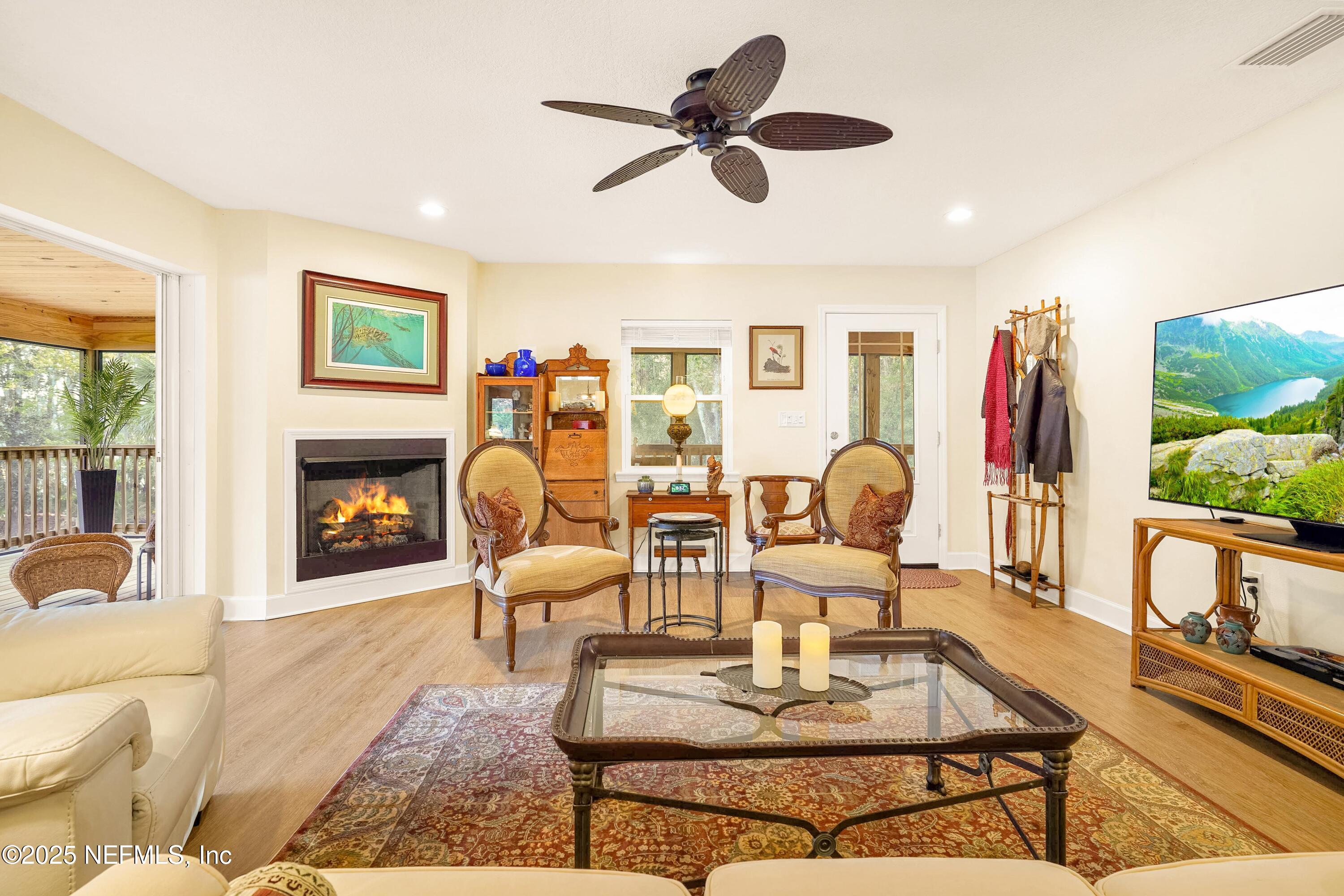 122 Drayton Island Road Georgetown, FL 32139 - Photo 25 of 59 a living room with furniture fireplace and a large window