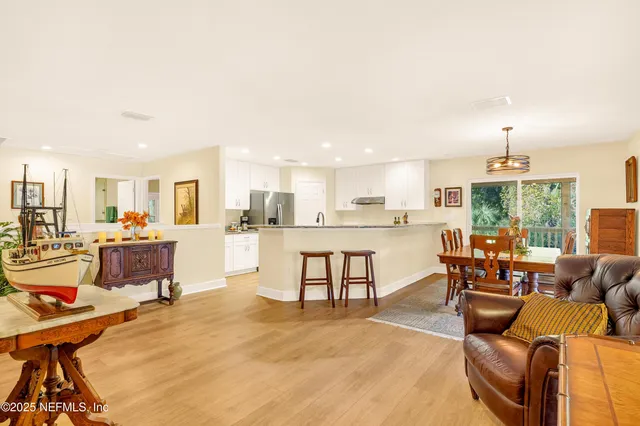 a bathroom with a double vanity sink toilet and shower