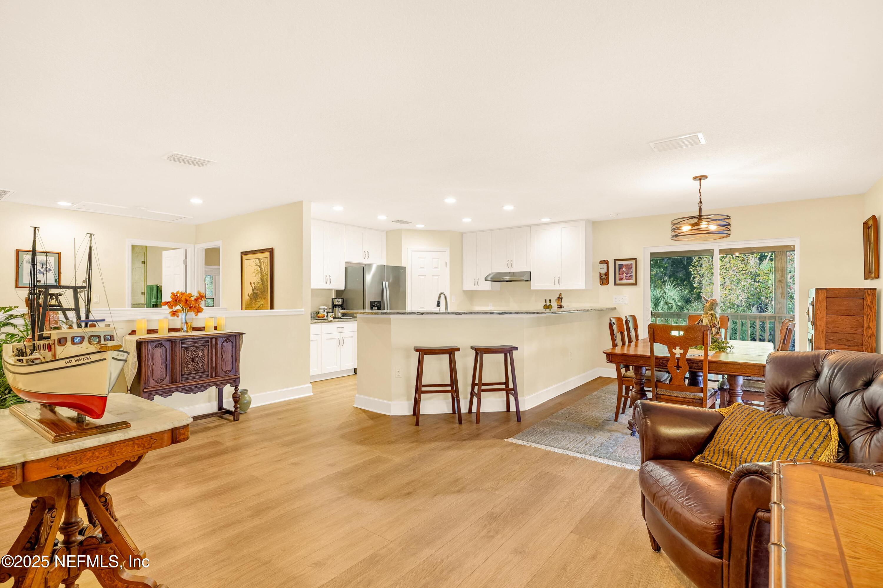 122 Drayton Island Road Georgetown, FL 32139 - Photo 26 of 59 a living room with furniture and a dining table with kitchen view
