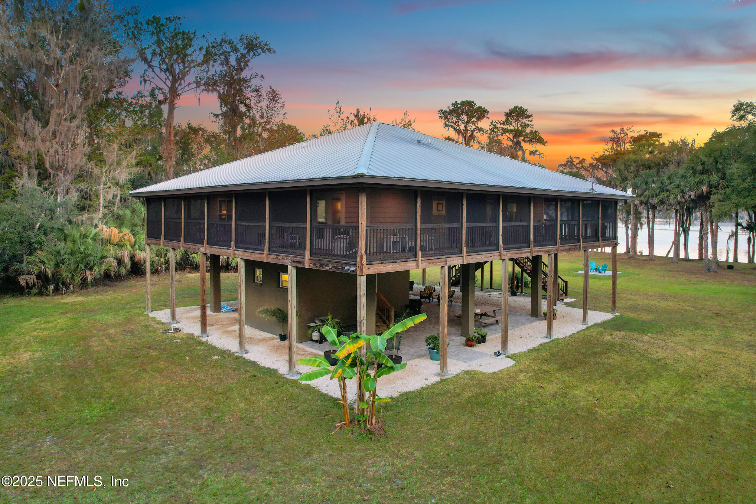 122 Drayton Island Road Georgetown, FL 32139 - Photo 3 of 59 a view of a chair and table in backyard of the house