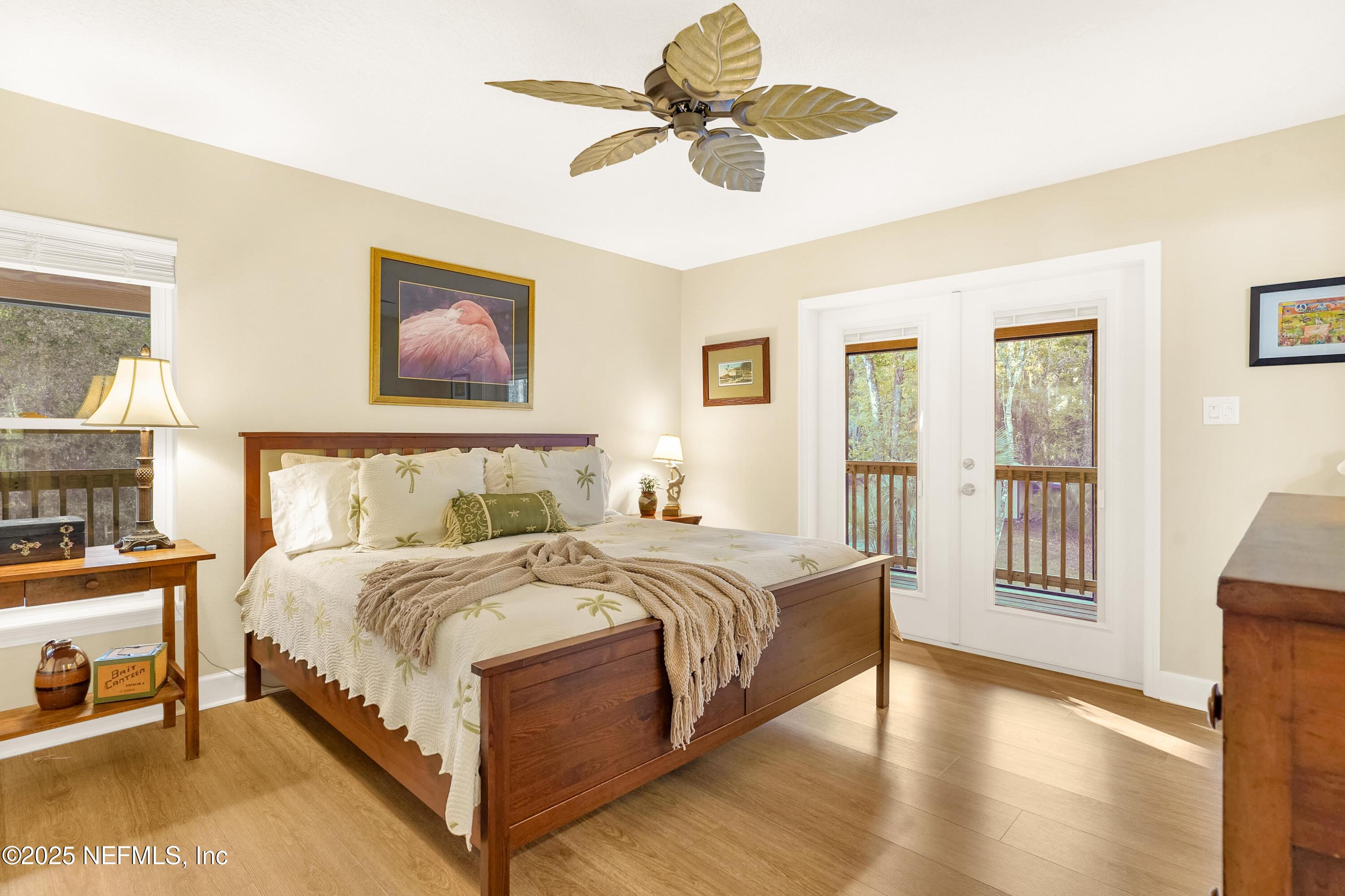 122 Drayton Island Road Georgetown, FL 32139 - Photo 32 of 58 a bedroom with a bed chandelier and a window