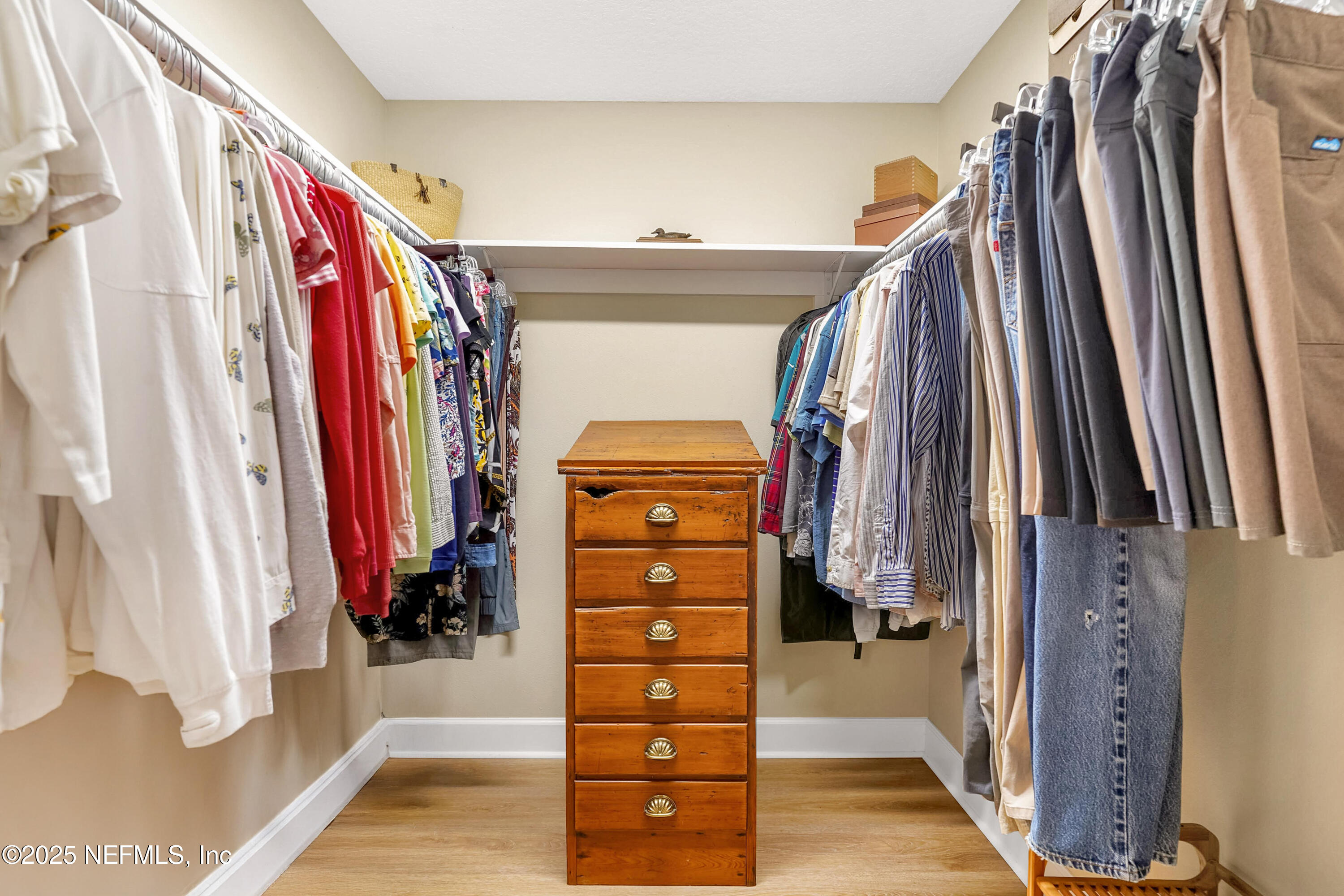 122 Drayton Island Road Georgetown, FL 32139 - Photo 37 of 58 a view of walk in closet with clothes and shoes