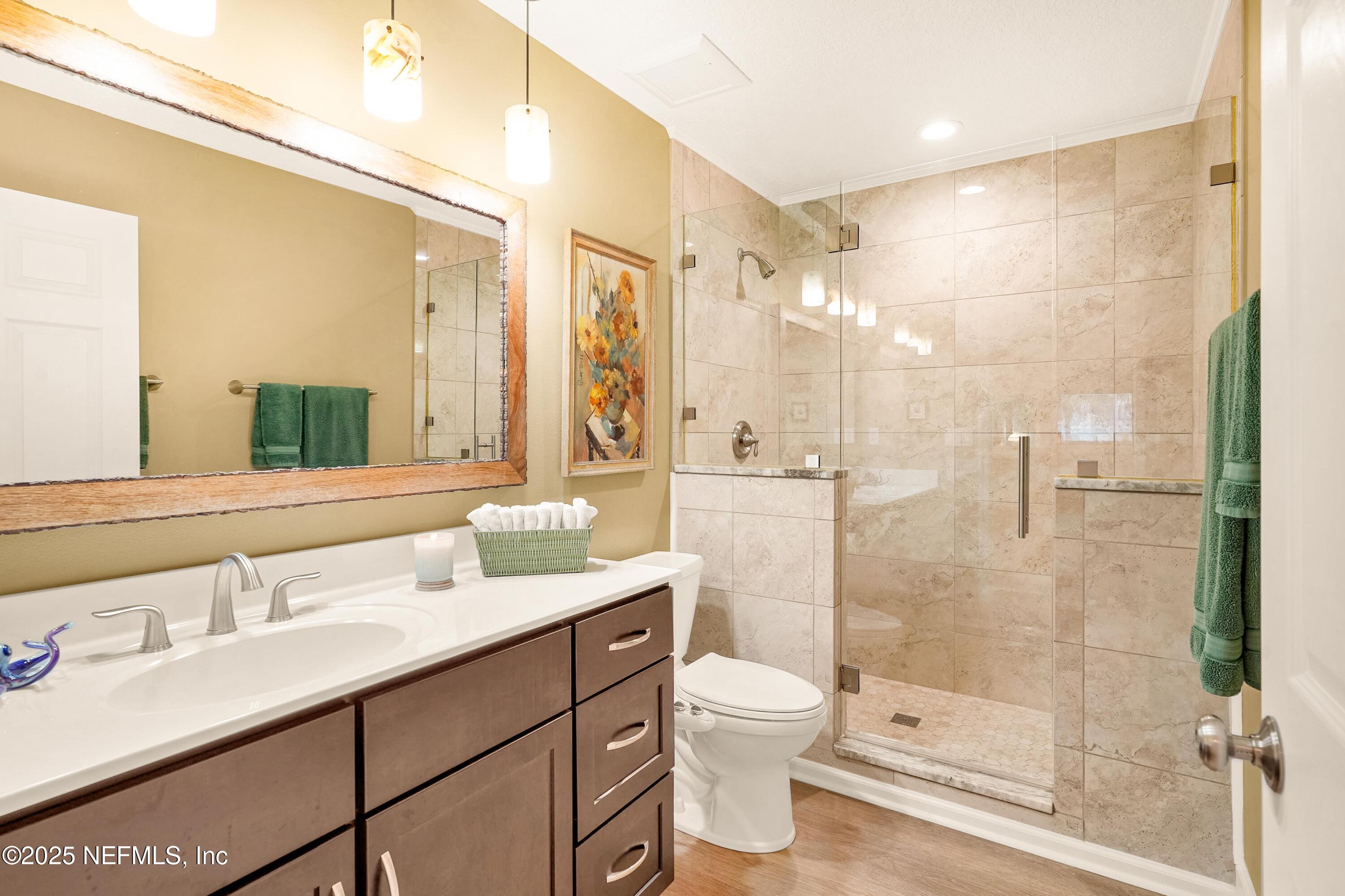 122 Drayton Island Road Georgetown, FL 32139 - Photo 39 of 59 a bathroom with a double vanity sink toilet and shower