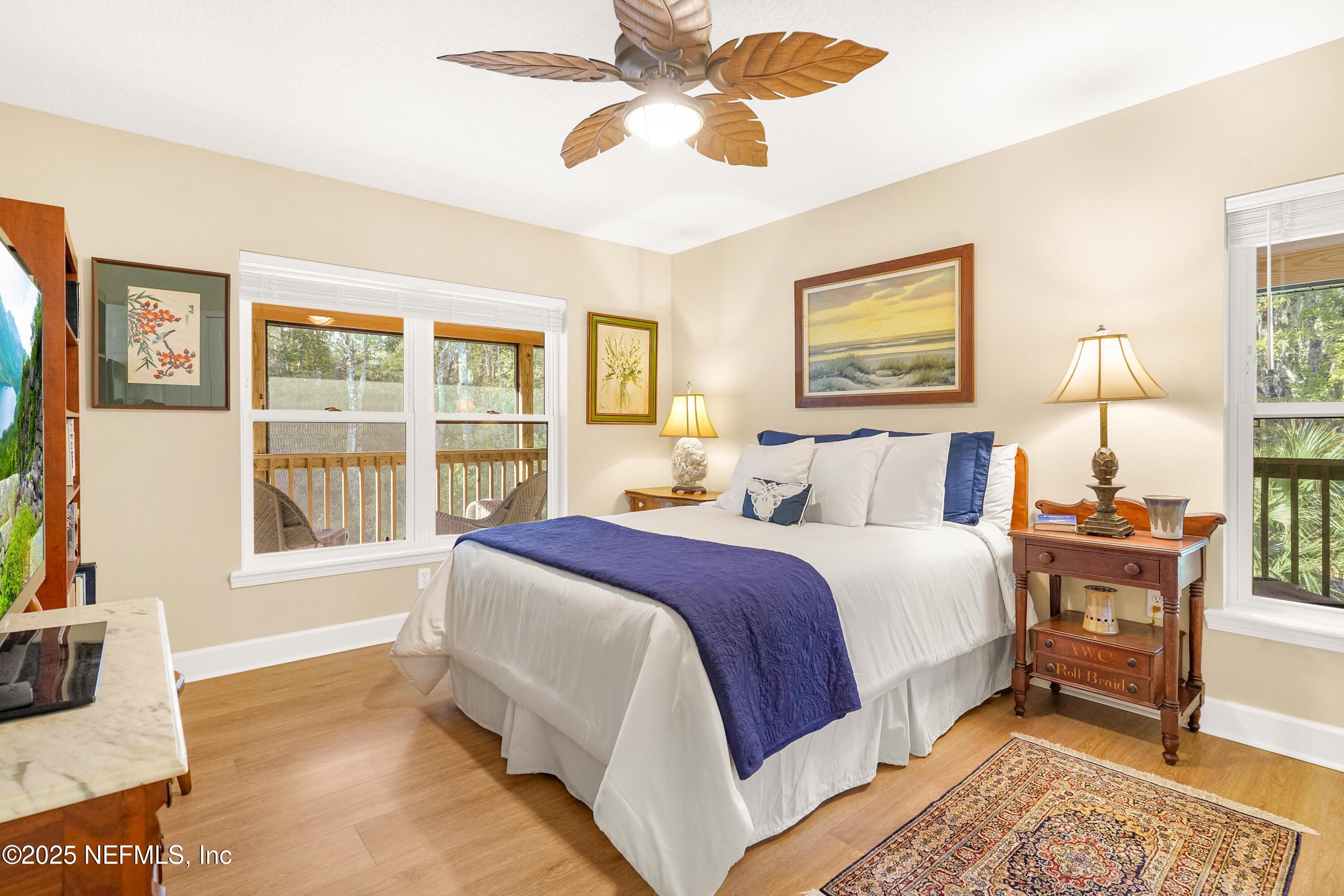 122 Drayton Island Road Georgetown, FL 32139 - Photo 39 of 58 a spacious bedroom with a large bed and a window