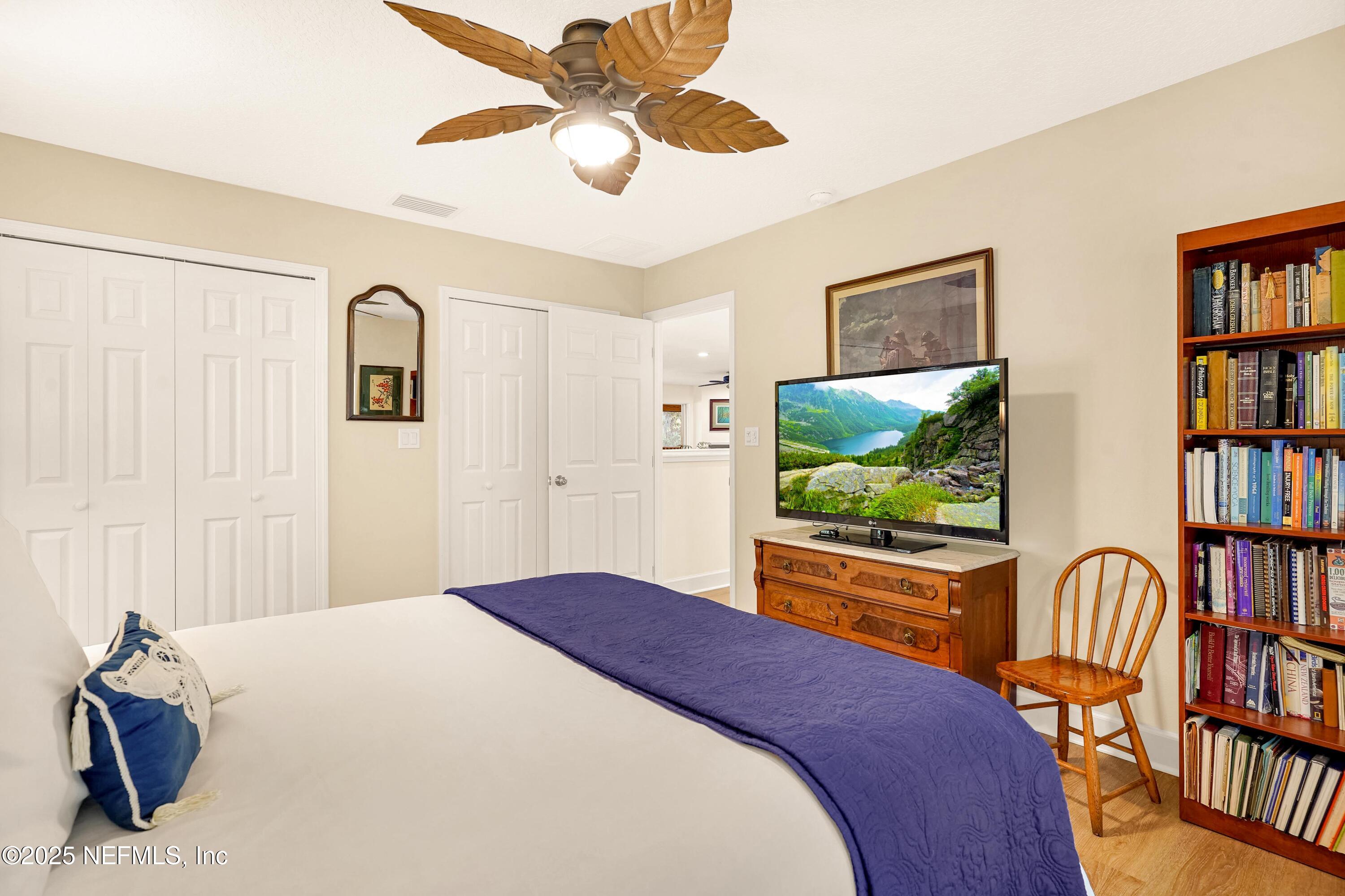 122 Drayton Island Road Georgetown, FL 32139 - Photo 40 of 58 a bedroom with a bed and a flat screen tv