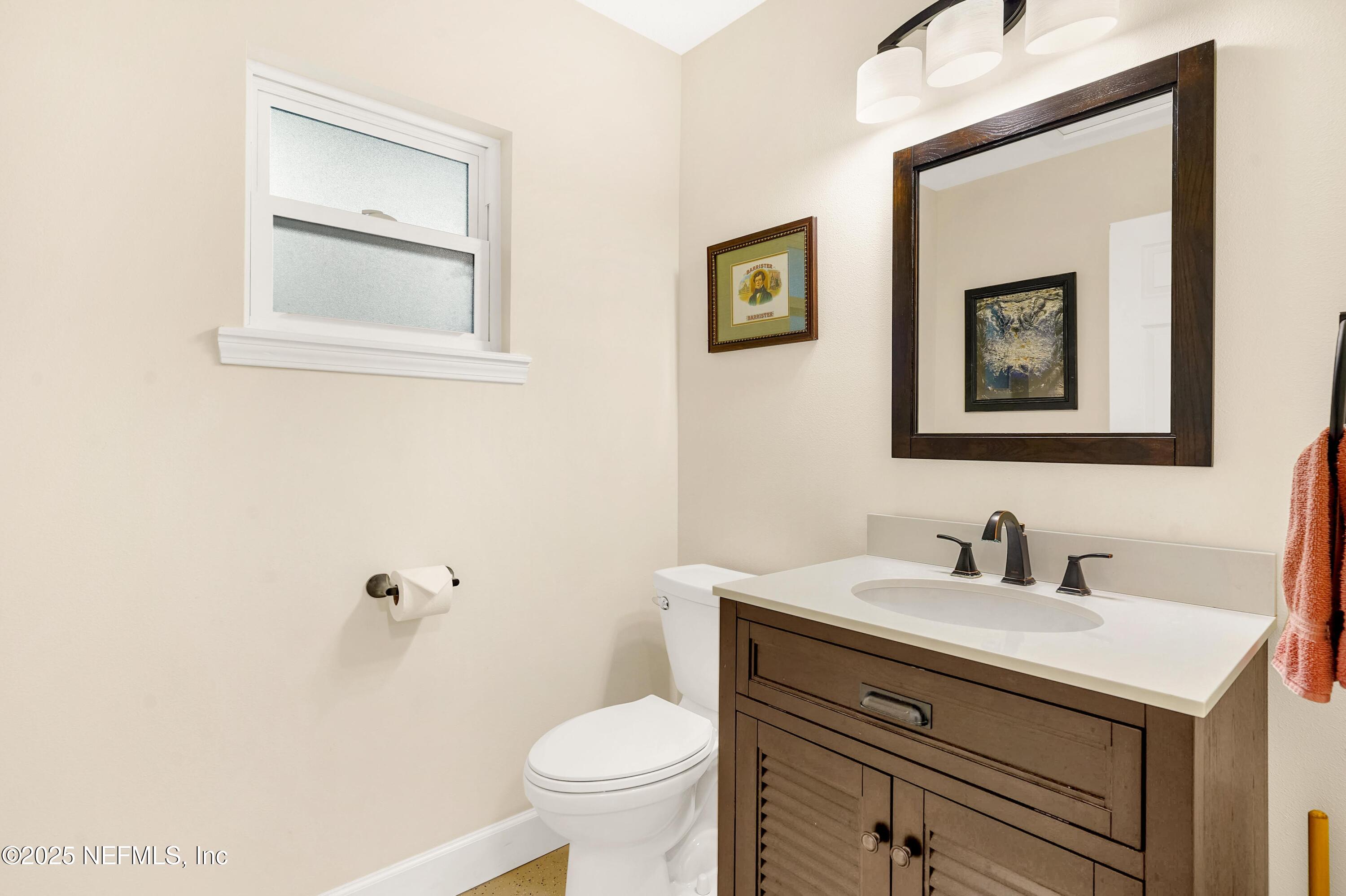 122 Drayton Island Road Georgetown, FL 32139 - Photo 43 of 58 a bathroom with a sink mirror and toilet