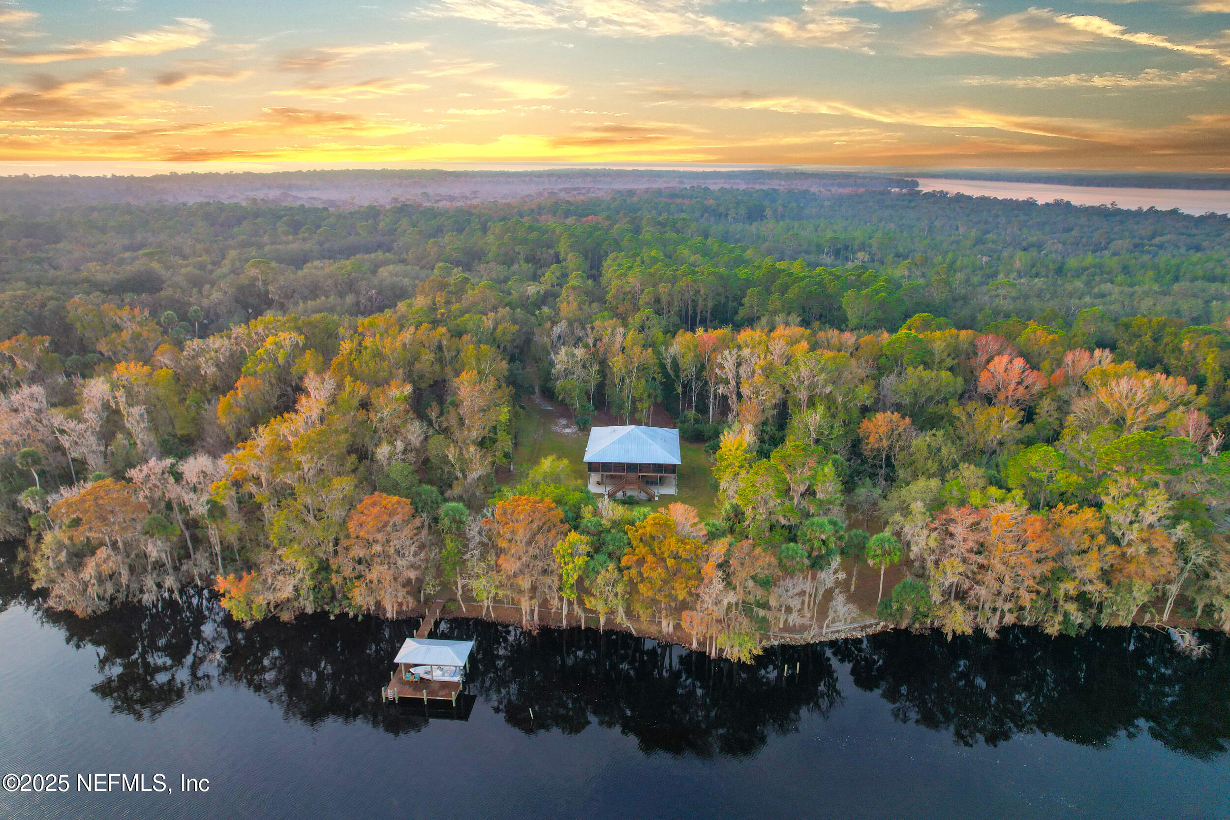 122 Drayton Island Road Georgetown, FL 32139 - Photo 57 of 59 a view of a lake with a mountain in the background