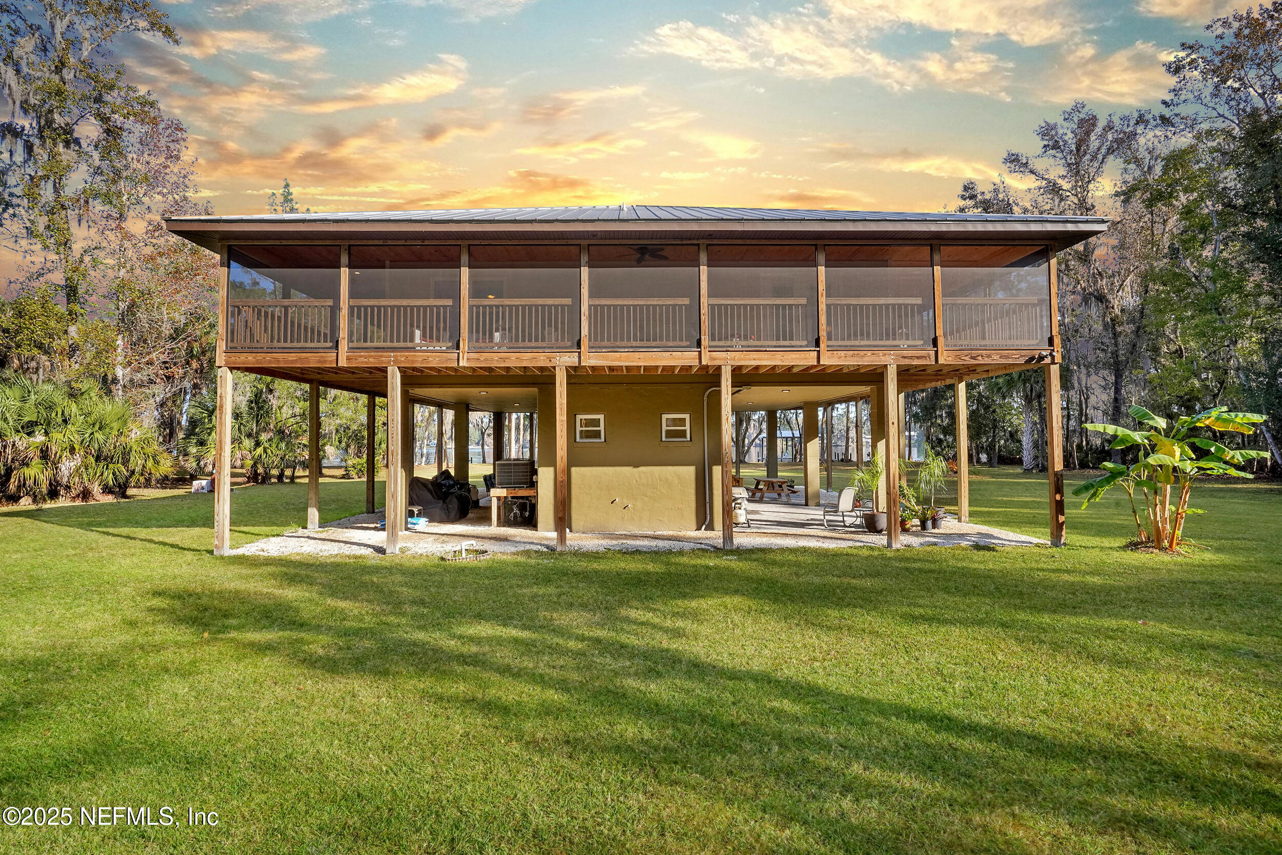 122 Drayton Island Road Georgetown, FL 32139 - Photo 9 of 59 a view of a house that has a big yard
