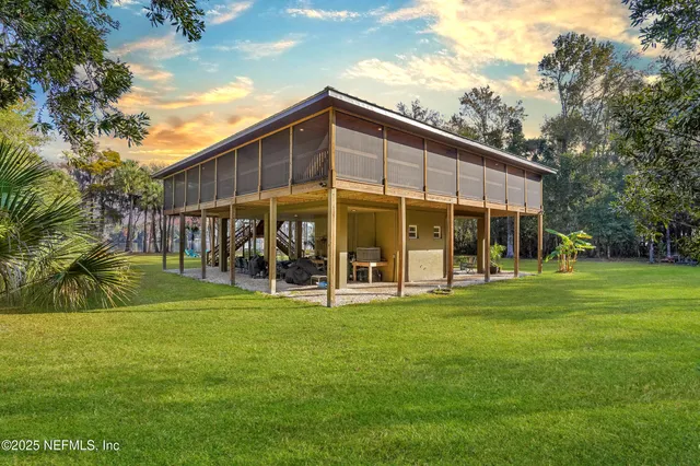 a outdoor living space with furniture and a floor to ceiling window