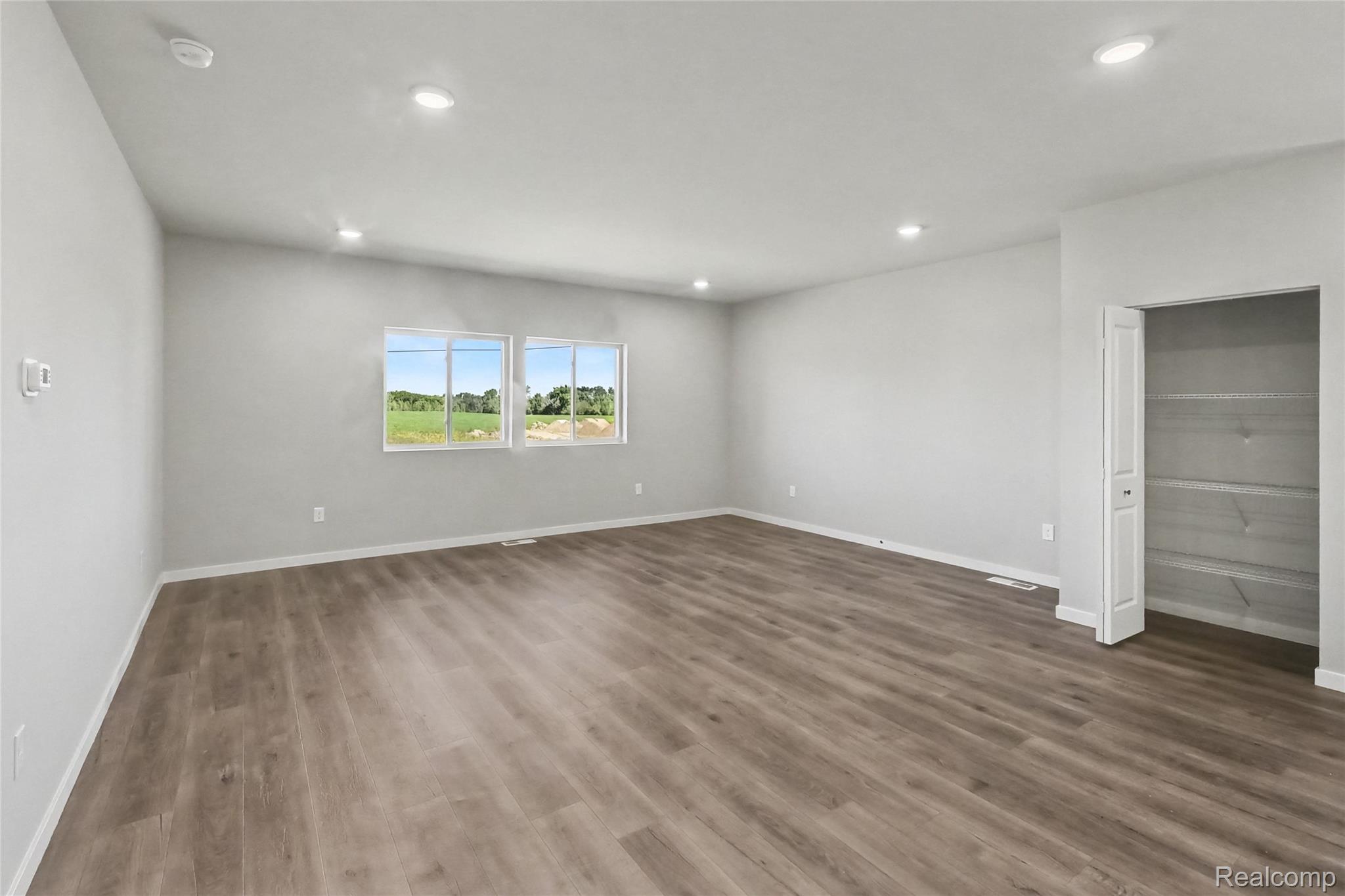 5528 Lahring Road Linden, MI 48451 - Photo 35 of 39 The open concept floorplan allows cohesive flow between the kitchen and dining room to a spacious great room.