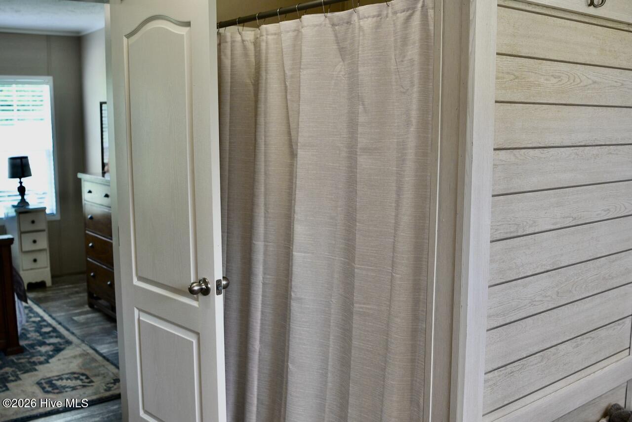 1430 Nixonton Road Elizabeth City, NC 27909 - Photo 19 of 30 The primary suite bathroom offers a shower and tub combo.