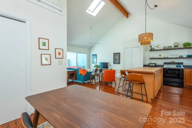 a room with furniture a dining table and chairs
