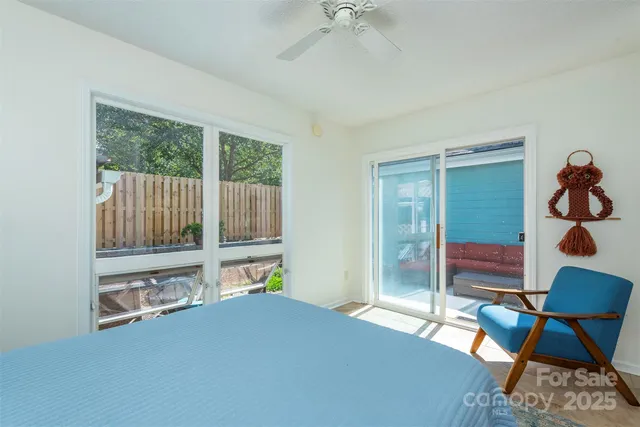 a bedroom with furniture and a window