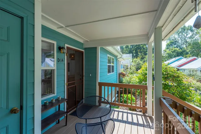 a view of a balcony with chairs