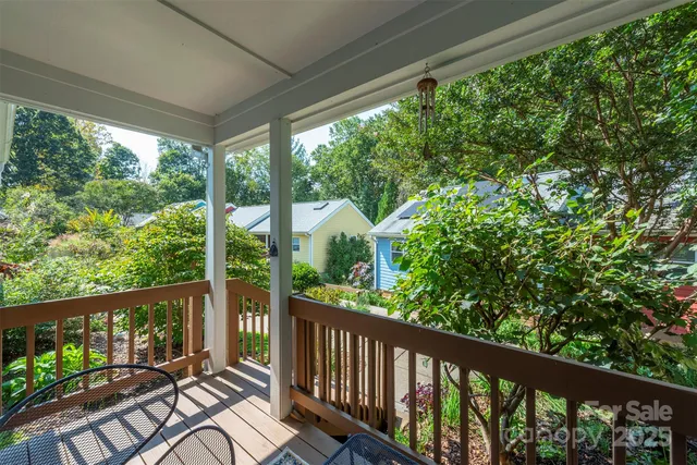 a view of a balcony with wooden floor
