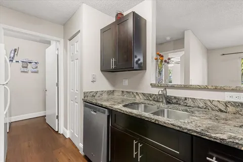 a kitchen with appliances cabinets and a counter top space