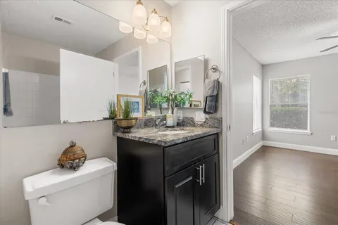 a bathroom with a bathtub with a shower