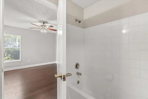a bathroom with a bathtub and a shower