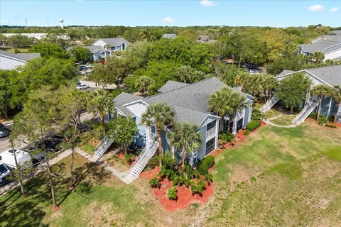 an aerial view of a house with a yard