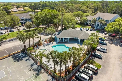 a view of a swimming pool with a yard