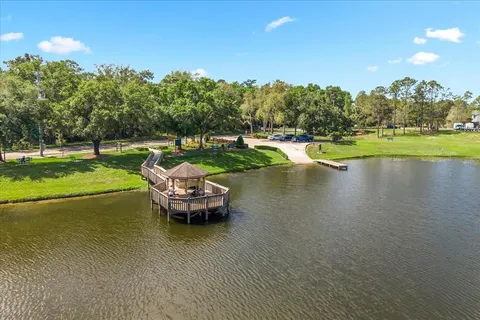 an aerial view of a houses with lake view