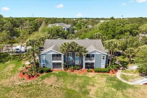 an aerial view of a house having yard