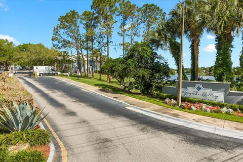 a view of a lake with houses in the back
