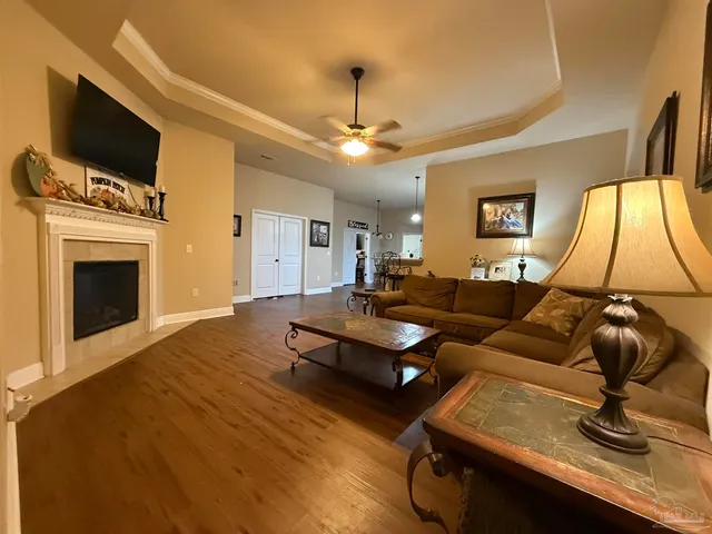 a living room with furniture and a flat screen tv