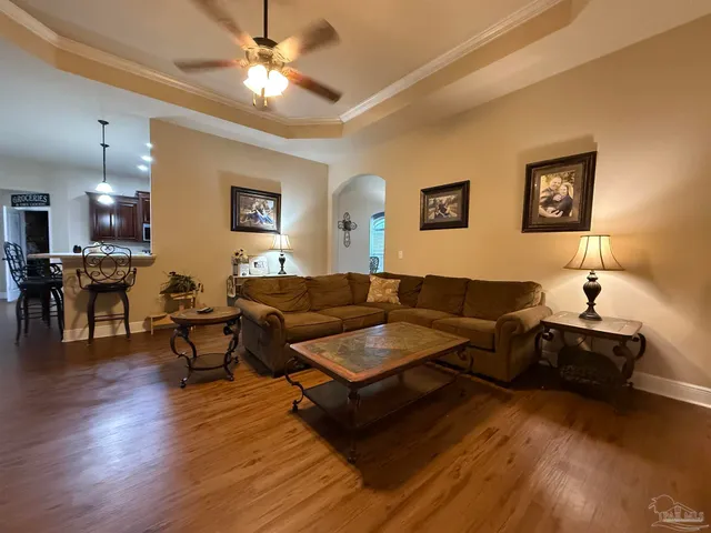 a living room with furniture and a flat screen tv