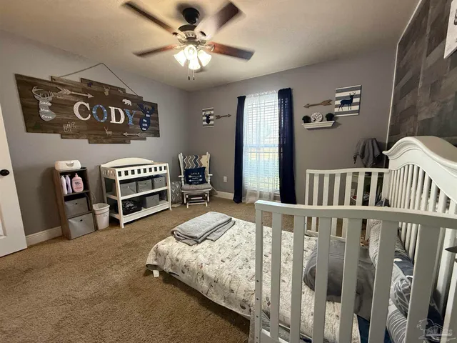 a bedroom with bed and a fireplace