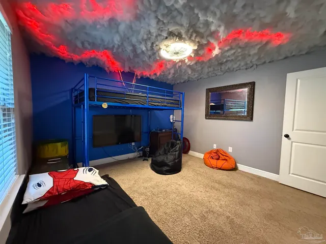 a bathroom with a granite countertop sink mirror vanity and toilet