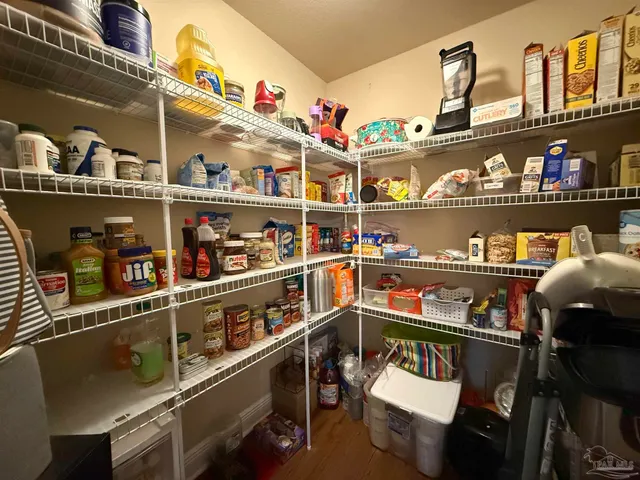 a view of swimming pool with an outdoor seating