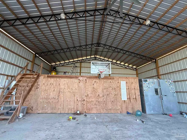 a room with gym equipment and a window