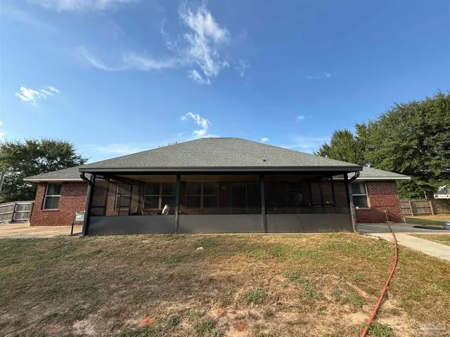 a view of a livingroom with furniture and a flat screen tv