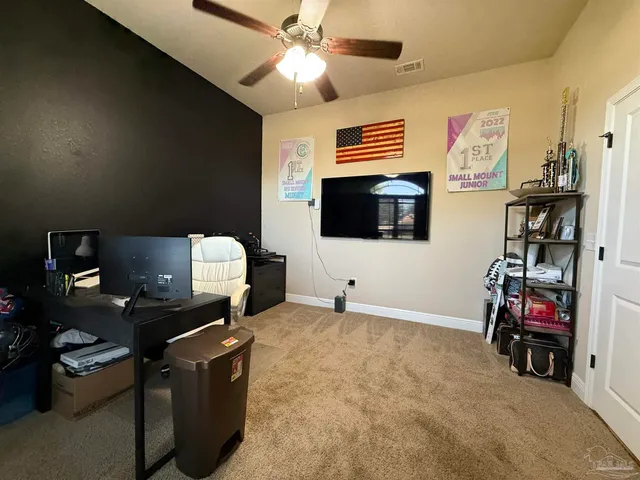 a room with furniture and a flat screen tv