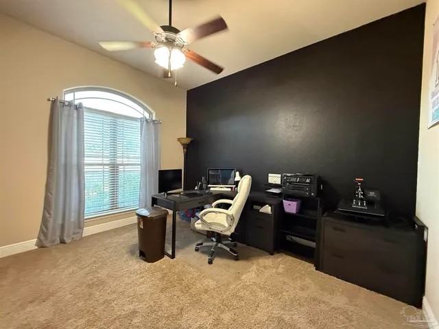 a view of a workspace with furniture