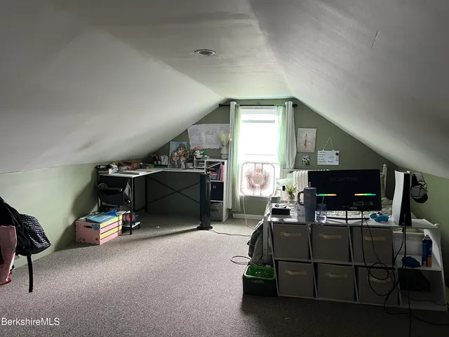 a room with furniture and a flat screen tv