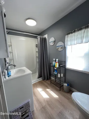 a bedroom with a bed and a bookshelf