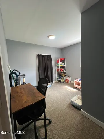 a bedroom with bed and a couch