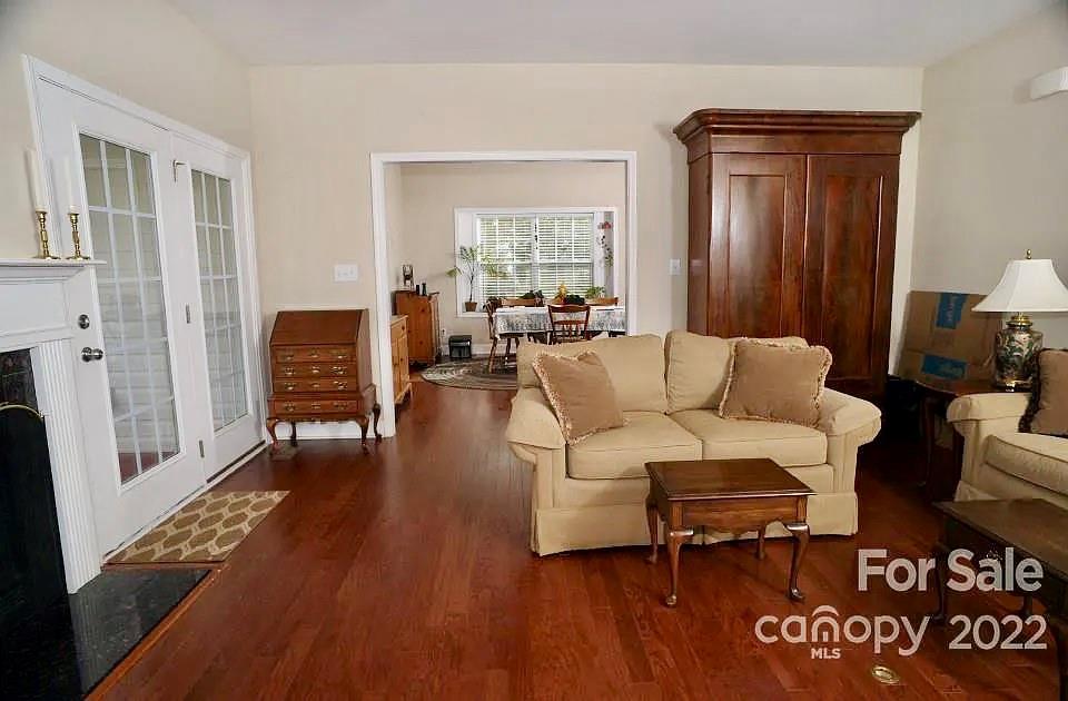 220 Sloan Road Salisbury, NC 28147 - Photo 14 of 30 a living room with furniture a large window and wooden floor