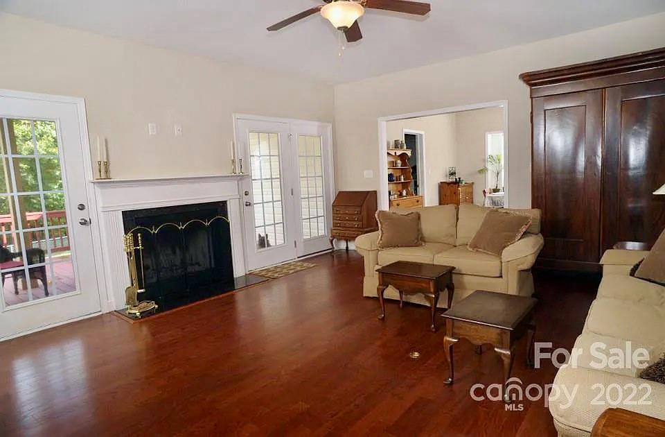 220 Sloan Road Salisbury, NC 28147 - Photo 15 of 30 a living room with furniture and a fireplace