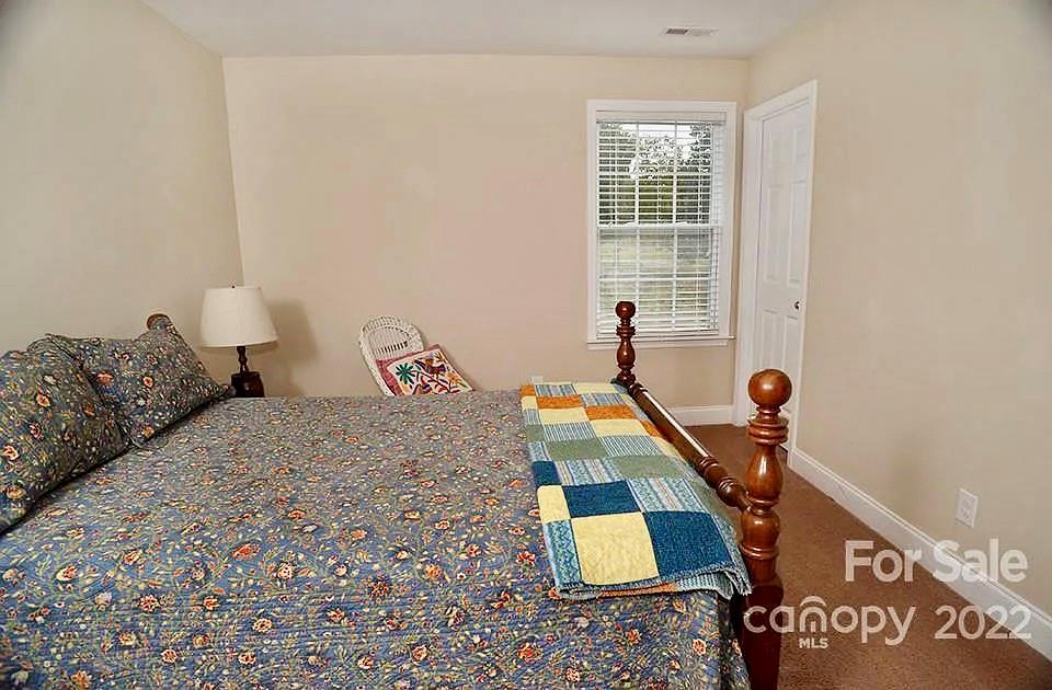 220 Sloan Road Salisbury, NC 28147 - Photo 20 of 30 a bedroom with a bed and window