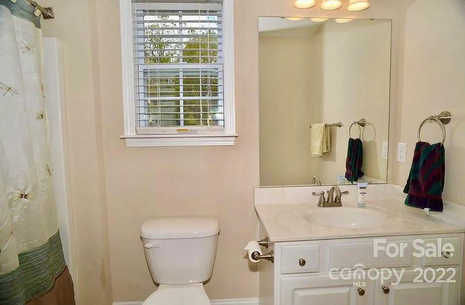 220 Sloan Road Salisbury, NC 28147 - Photo 21 of 30 a bathroom with a sink and a mirror with toilet