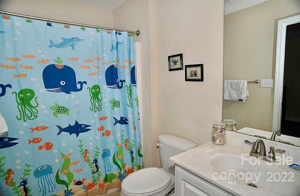220 Sloan Road Salisbury, NC 28147 - Photo 24 of 30 a bathroom with a sink toilet and curtain