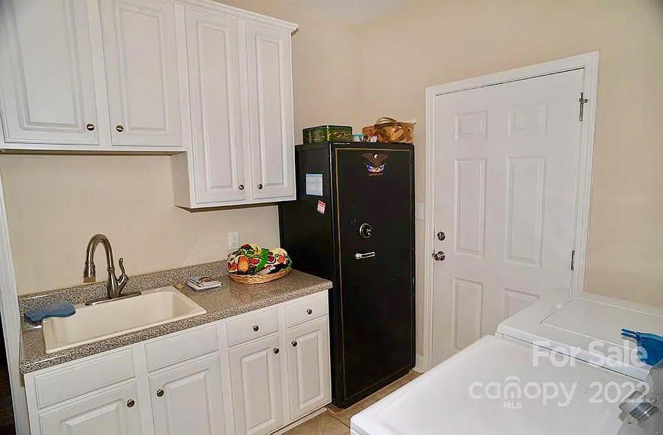 220 Sloan Road Salisbury, NC 28147 - Photo 25 of 30 a kitchen with stainless steel appliances granite countertop a refrigerator and a sink