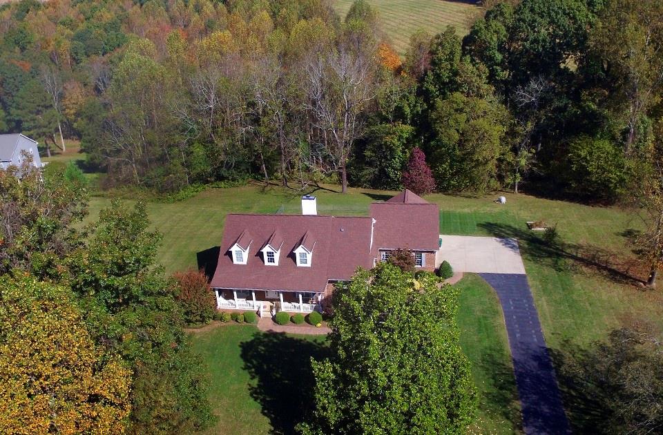 220 Sloan Road Salisbury, NC 28147 - Photo 28 of 30 an aerial view of a house with a garden and trees